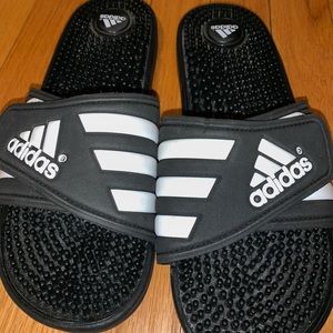 Women’s black Adidas slides